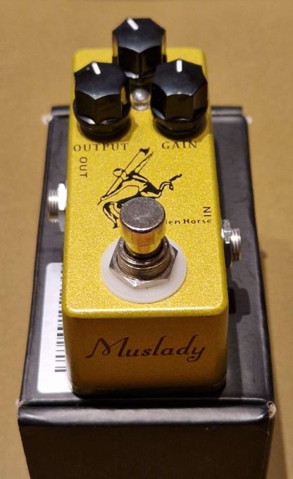 Mosky Audio Golden Horse overdrive effects pedal on top of the box.